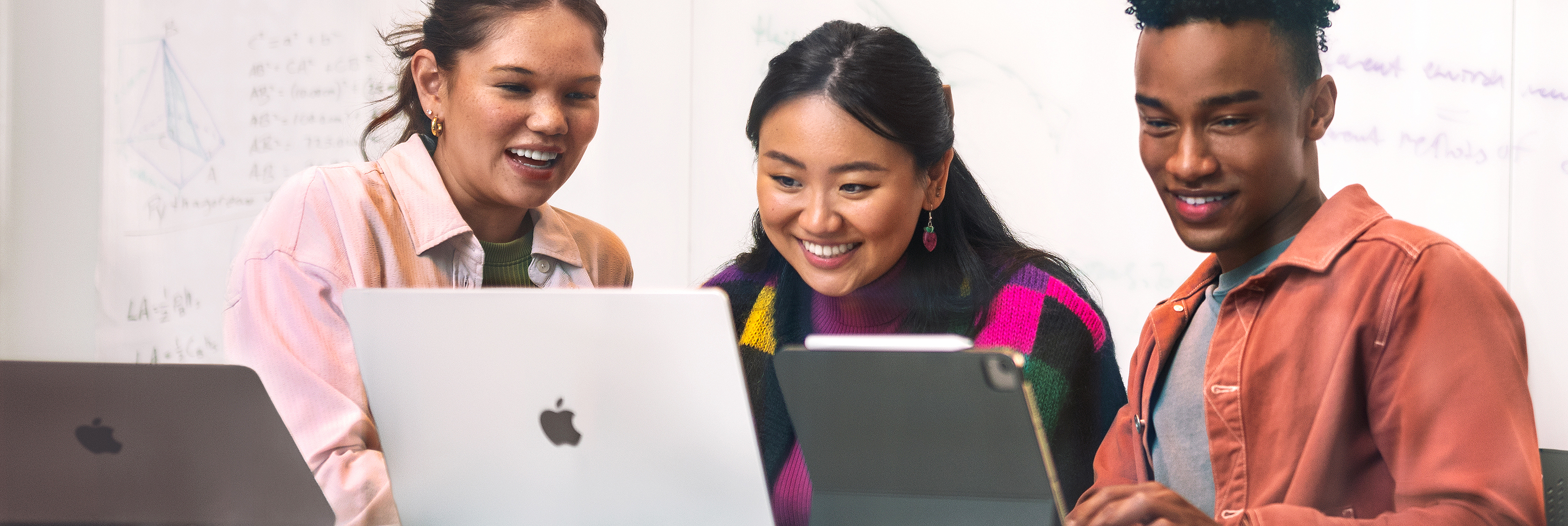 A Swift Coding Club group working on iPad and Mac.